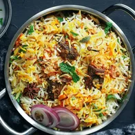 Chicken biryani served in a kadai